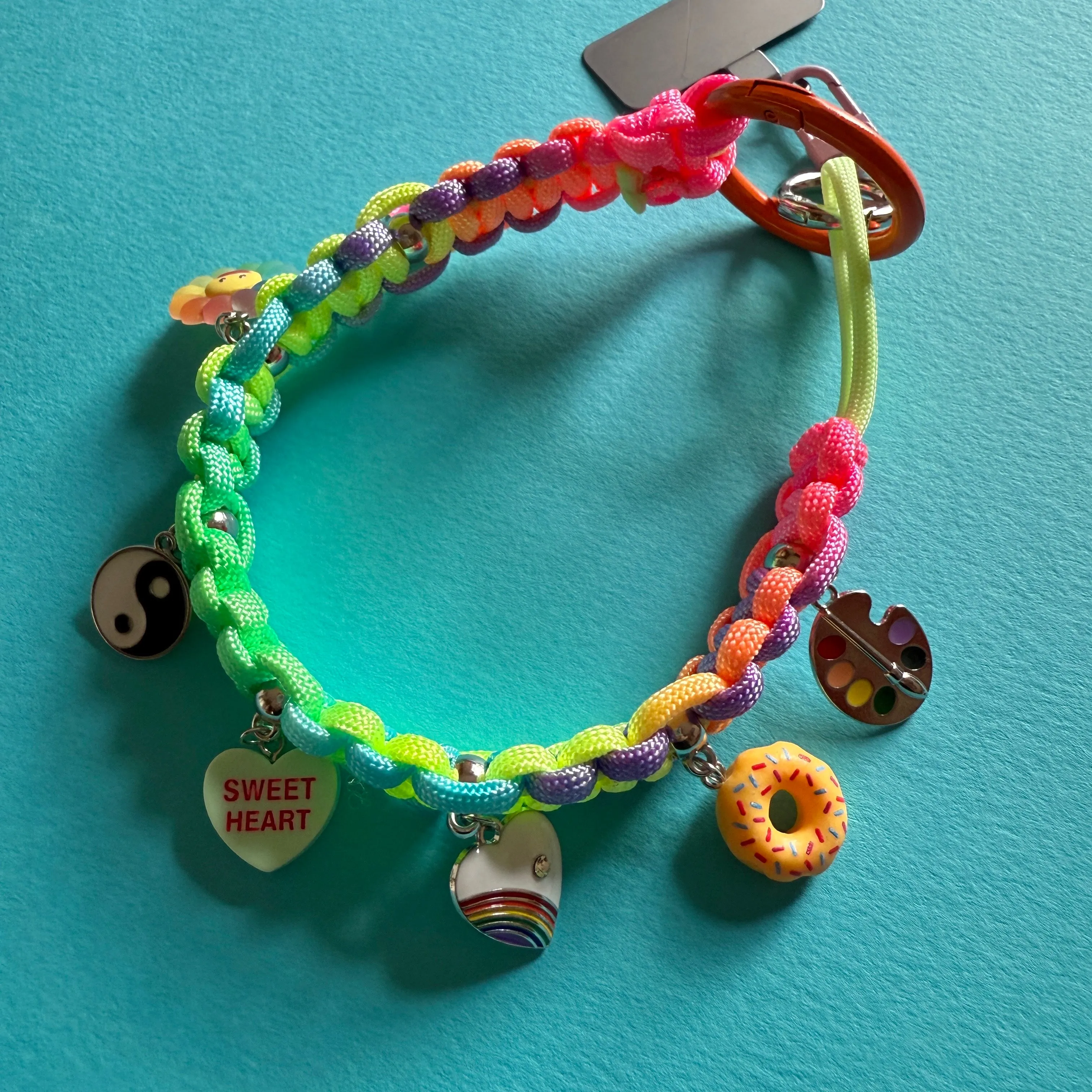 Phone wrist strap with charms